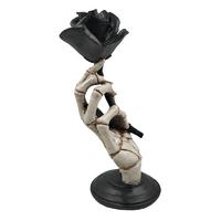 Hot sale personalized handmade polyresin skeleton hand holding a black rose statue